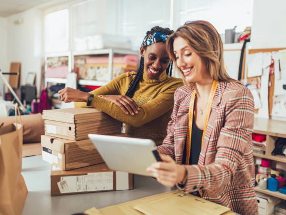 Two Women Looking At Tablet Two Women Looking At Tablet