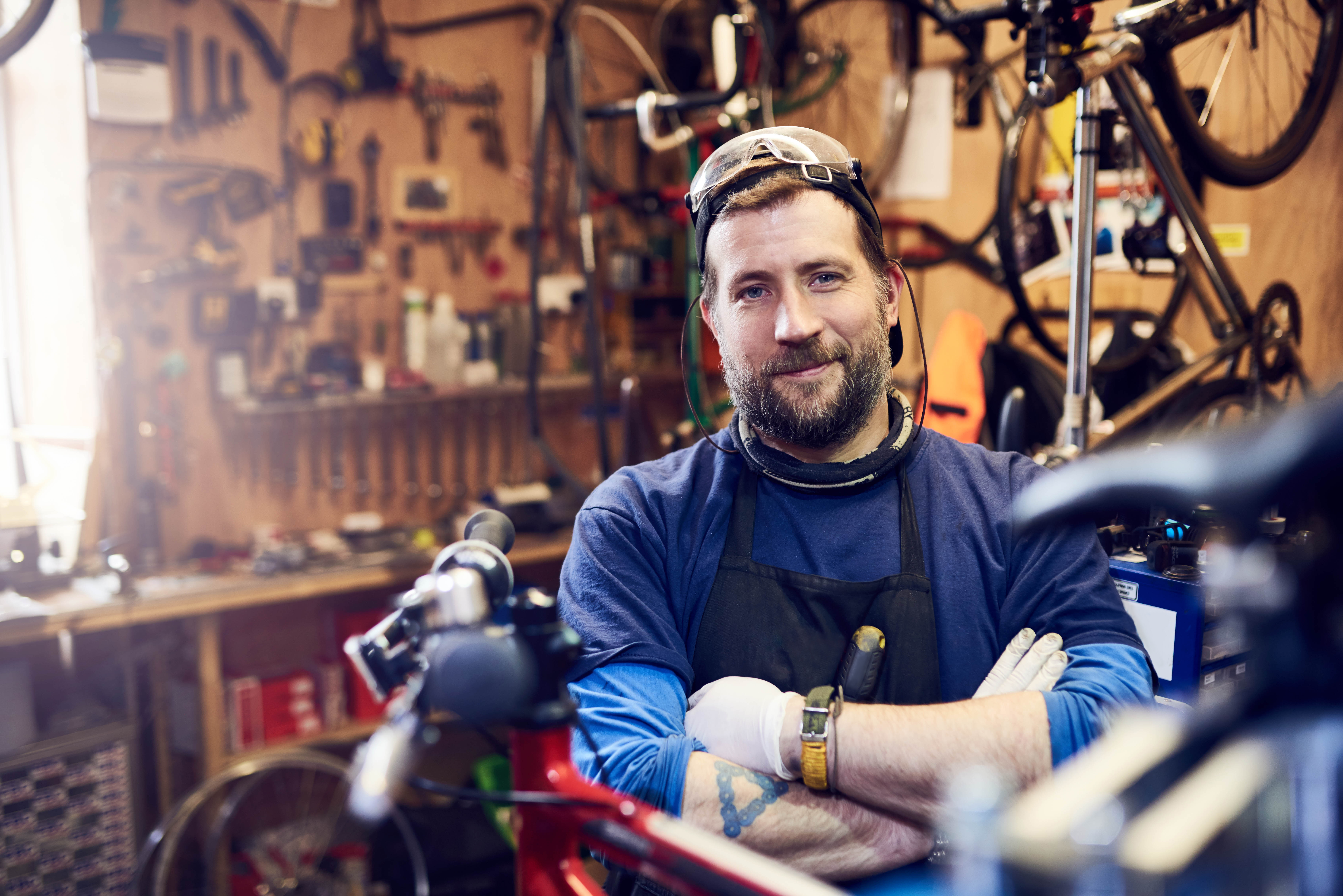 Man With Folded Arms In Workshop