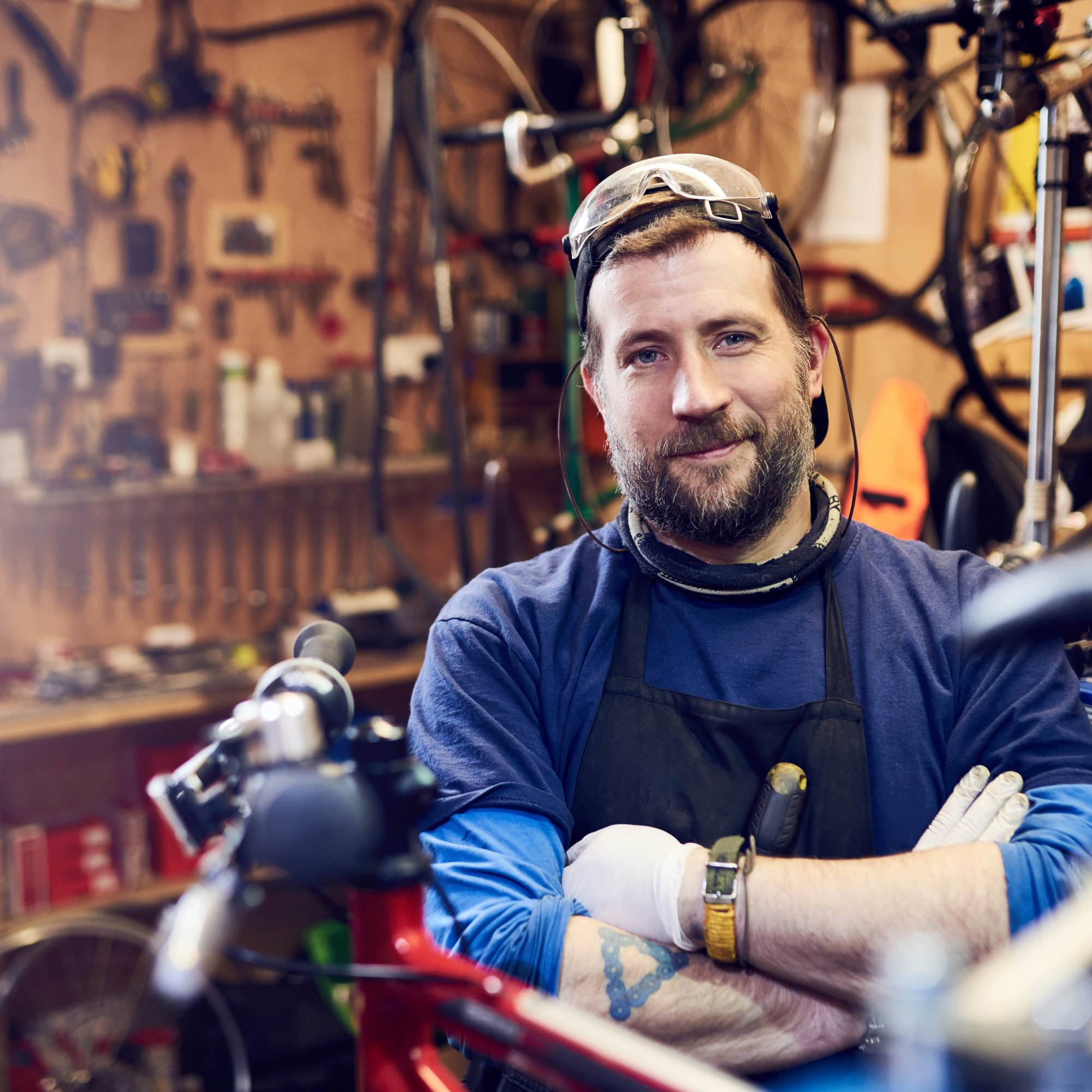 Man With Folded Arms In Workshop
