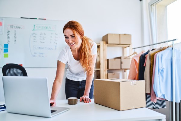 Woman Leaning Over Desk